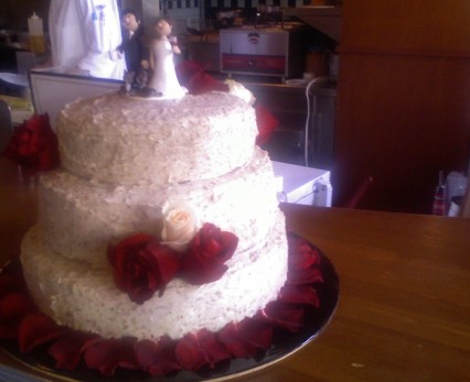 Blurry photo of the wedding cake I assisted on - red velvet with cream cheese/marshmallow/toasted pecan frosting.
